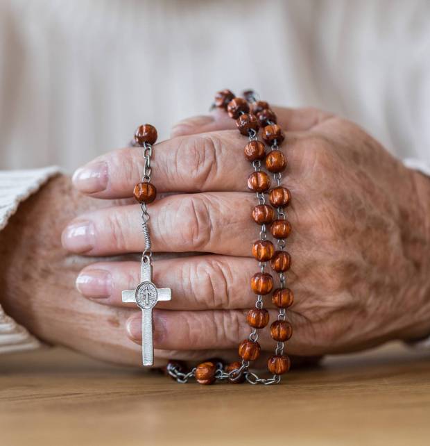 senior-s-hands-with-red-rosary-2022-02-01-23-42-27-utc-2